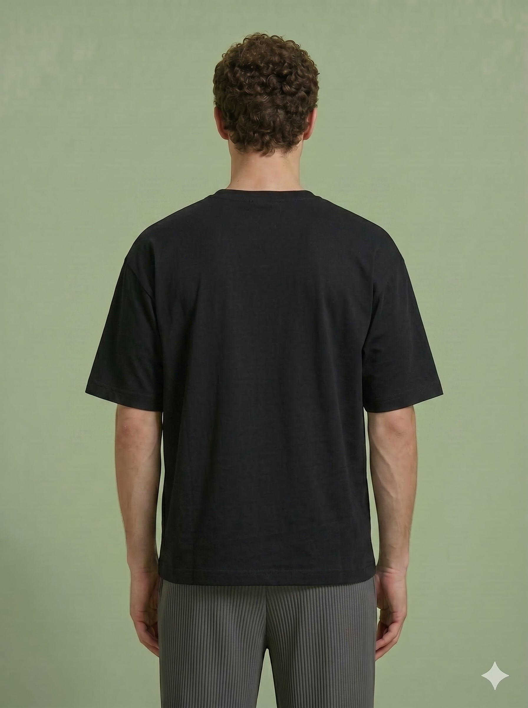 Hilos Apparel black cotton blend oversized t-shirt with crewneck and chest pocket detail.